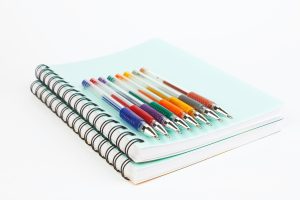 notebooks and pens
